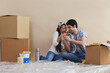 © IndiaPix - Happy young couple sharing pizza at their new home
