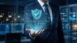 © Wannaeka - Digital verification and internet security concept with a businessman presenting a glowing shield interface.