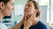 © Hendrik - Doctor examines patient's neck for thyroid issues