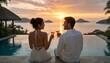 © AZIM - Happy couple enjoying a romantic sunset toast by the infinity pool at a tropical resort