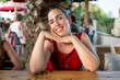 © davide bonaldo - smiling young woman posing outdoor terrace cafe bar, happy millennial in her 40s with digital nomad lifestyle