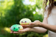 © Кристина Чижмар - Small kawaii dumpling squishy toy resting on an open palm.