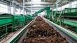 © Bussakon - Industrial composting facility with green hinery processing organic waste along conveyor belts under natural light