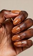 © Natalia - Close Up of Hand with Brown Nail Polish and Gold Ring for Beauty Marketing