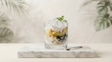 Refreshing dessert with fruit and cream in a glass