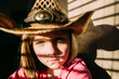 © Natalie Wheeler - Moody Portrait of a Girl in Cowboy Hat