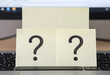 © Pixel-Shot - Uncertainty and decision making, question marks on sticky notes on a laptop keyboard, business challenges and problem solving