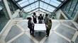 © Sophia - Diverse business team collaborating over blank architectural blueprint