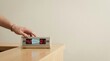 © KohXD - Person advancing a clock to illustrate customer waiting time reduction between request and service fulfillment