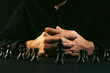 © Artvibe - Close up of a man playing chess on a dark background with copy space