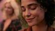 © AndyAziz - Woman with dark curly hair in casual outdoor setting with friend