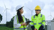 © อภิสิทธิ์ ปักเหนือ - Clean Energy Engineers Reviewing Data at Wind Farm