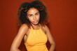 © Gonzalo Infiesta - Young black woman posing confidently with natural curly hair