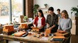 © MstMonoara - Diverse happy group of friends or small business employees packing Halloween themed boxes for festive celebration or online orders