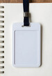 © Pixel-Shot - Blank id card or name tag on a spiral notebook, corporate identity and event access concept, space for text