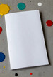 © Pixel-Shot - Creative blank canvas for art and design, empty white paper with colorful paint drops and splatters on gray background