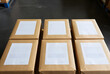 © Pixel-Shot - Logistics and supply chain management, cardboard boxes with blank labels ready for shipping in a warehouse