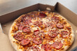 © Sanlad - Close-up of thin crust pepperoni pizza with melted mozzarella