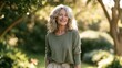 © Oleksandr - Content woman in casual attire savoring fresh air and nature