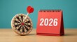 © Yellow Blossom - Business goals and planning for 2026 success visualized with a target and red calendar.