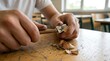© Sohel - Student sharpening wooden pencil with metal sharpener at school desk