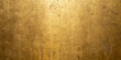 © Shahidul - Textured metallic gold surface with subtle scratches and warm diffused lighting for backgrounds