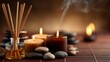 © Harry - Fragrant reed diffuser sticks placed next to glowing soy wax candles and smooth river stones for a relaxing spa atmosphere