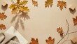 © OKA - Minimal autumn background with golden leaves, natural wood, linen and warm stone textures, clean empty center for ecommerce products and text
