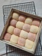 © Intan Prasiska - Freshly baked colorful soft pull apart bread buns in a square box packaging