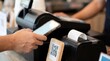 © Dimas Putra Kusumo - Customer paying with smartphone QR code at retail checkout counter