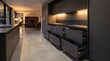 © Alex Volkov - Exhibit spacious dark minimalist kitchen featuring open sliding drawers and bright living area background