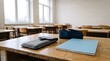 © Phatcharin - A lockable smartphone pouch sits on a wooden school desk next to a pencil case and notebook.