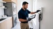 © Aurora Aesthetics - home inspector hvac smart technology property inspection maintenance energy system technician examines a connected climate control unit in a residential utility room while documenting system condition