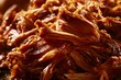 © Kristina - Slow cooked pulled pork served on a platter during a barbecue gathering in the backyard