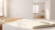 © inishita_info - Executive productivity and goal achievement concept: pristine open journal setup bathed in bright morning daylight with ample warm-white negative space.