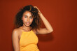 © Gonzalo Infiesta - Young woman showing afro curly hair beauty portrait
