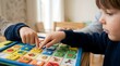 © Amir - Child using a picture communication board for speech therapy