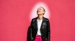 © Abdullah - A young woman with a buzz cut laughing against a vibrant pink wall