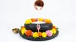 © Hardikbhai bhamani - Shivling Abhishekam with Copper Pot, Colorful Flowers and Green Leaves