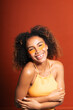 © Gonzalo Infiesta - Smiling young woman applying hydrating under eye patches
