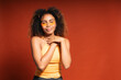 © Gonzalo Infiesta - Young woman winking wearing orange eye patches
