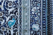 © finepoints - Ornate blue and white ceramic tilework with floral arabesque patterns at Pahlavan Mahmud Mausoleum in Khiva. Detailed close-up of traditional glazed tiles ideal for cultural heritage and design.