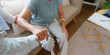 © Natee Meepian - Cropped view of caregiver holding hands with senior woman for home healthcare empathy