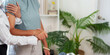 © Natee Meepian - Caregiver placing hand on senior patient shoulder for home health care support