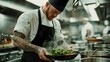 © Anousone - A male chef with tattoos preparing a gourmet meal in a bustling professional kitchen, intense focus, steam rising, dramatic overhead lighting