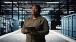 © DC Studio - Data center admin uses a tablet to coordinate new server architecture deployment and support a cybersecurity framework rollout across the server hub.