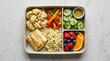 © PixelHub Studio - Healthy bento lunch box with grilled chicken vegetables cucumber slices and fresh berries. nut free meal plan