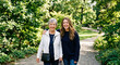© clara - Happy Senior Mother and Adult Daughter Walking in Summer Park