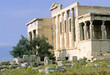 © robertharding - Erechtheum features Caryatids standing alongside ancient ruins on the Acropolis overlooking Athens