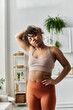 © LIGHTFIELD STUDIOS - Relaxing at home, this young woman enjoys a moment of peace and comfort
